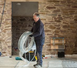 underfloor heating pipe being laid on Lewis Plate