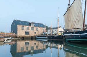 Insworke Mill barn conversion reflected in the water