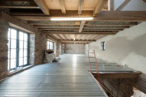 Various timber floor structures at Insworke Mill including exposed timber ceilings