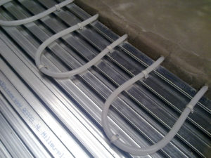 Lewis Deck and underfloor heating pipes