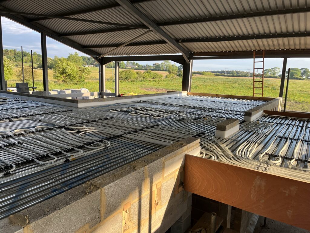 Underfloor heating installation on Lewis Deck in a new build barn conversion house build project